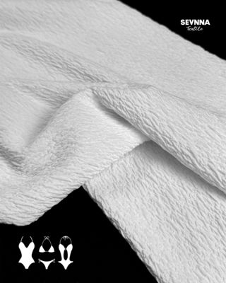 Tecido de malha dupla jacquard para produtos têxteis duráveis e versáteis
